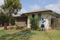 Exterior house pressure cleaning shown from a distance