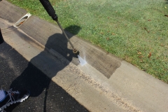 Pressure cleaning the concrete gutter can make a huge difference