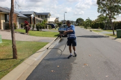 Watching Gary at work pressure cleaning from a nice dry distance