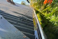 Cleaning gutters with leaf blower